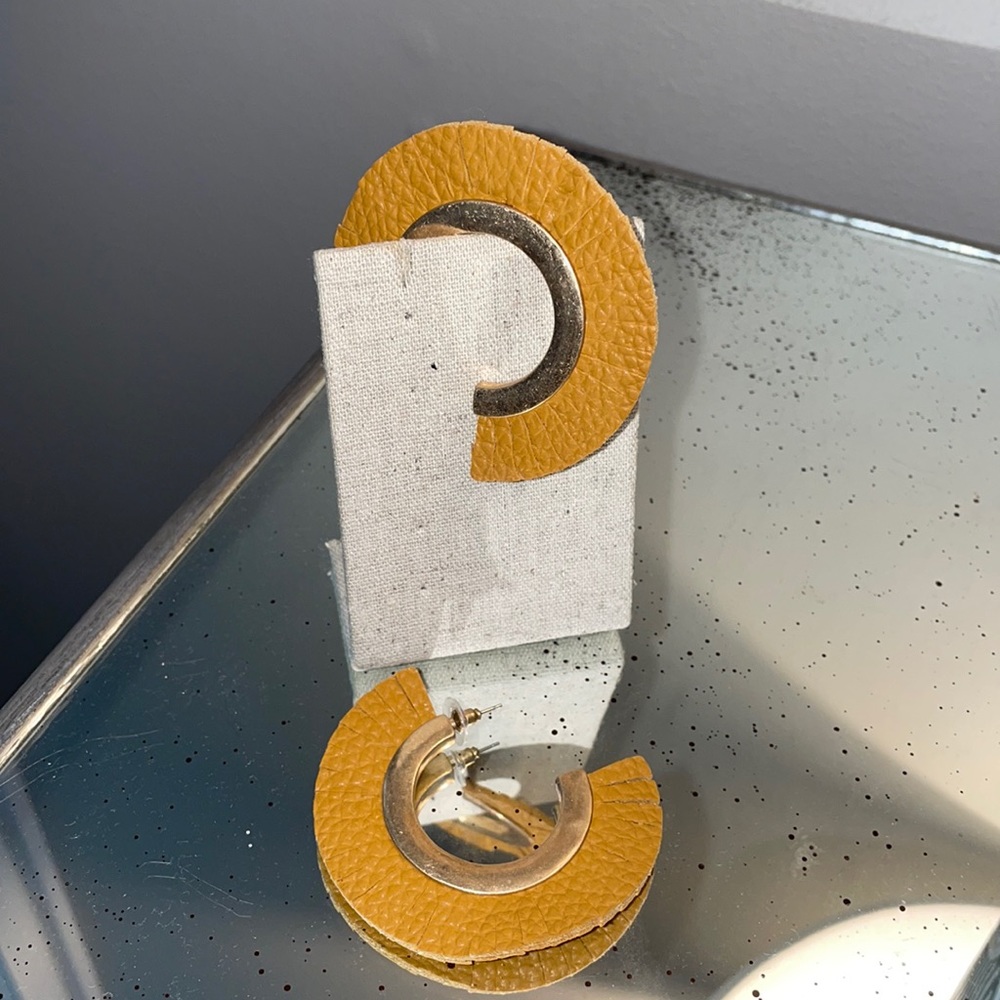 Brand new gold and leather fringe earrings.